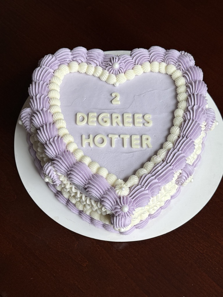 Lavender heart shaped cake with white piping and buttercream lettering
