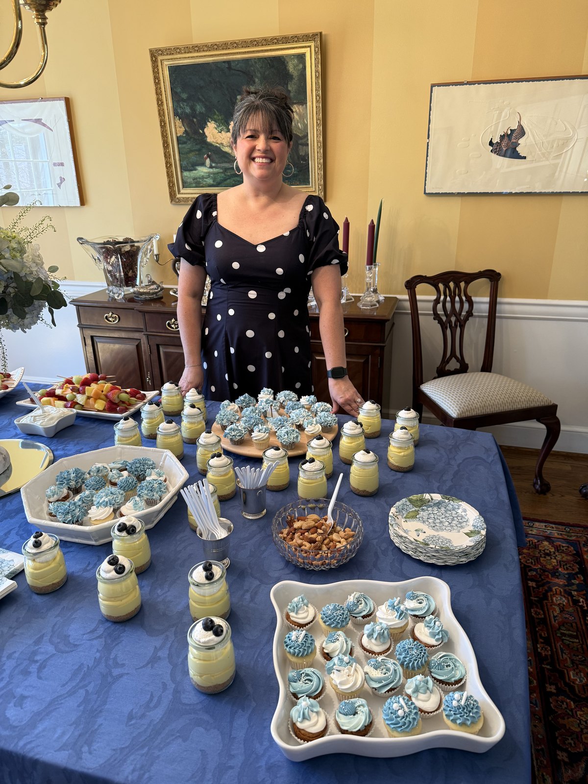 Shannon standing behind a dessert table with handmade sweets